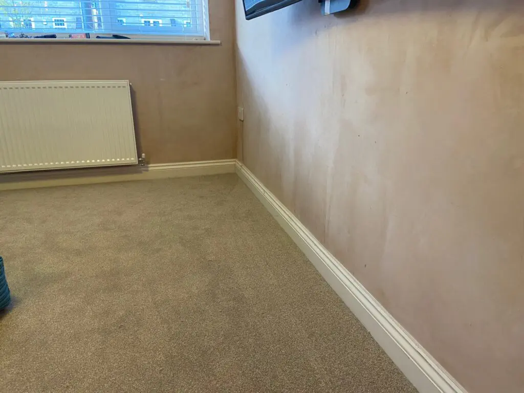 Newly fitted carpet in conversion of garage to living room